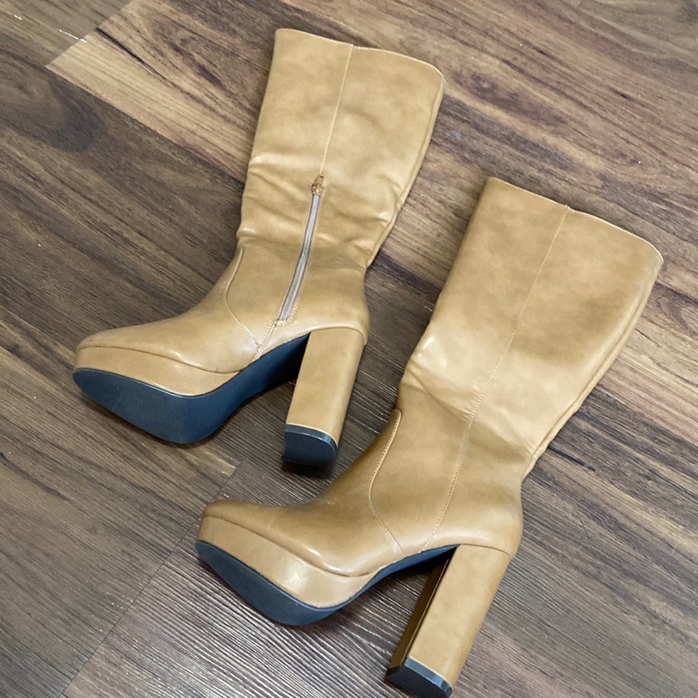 Tan knee high heeled boots